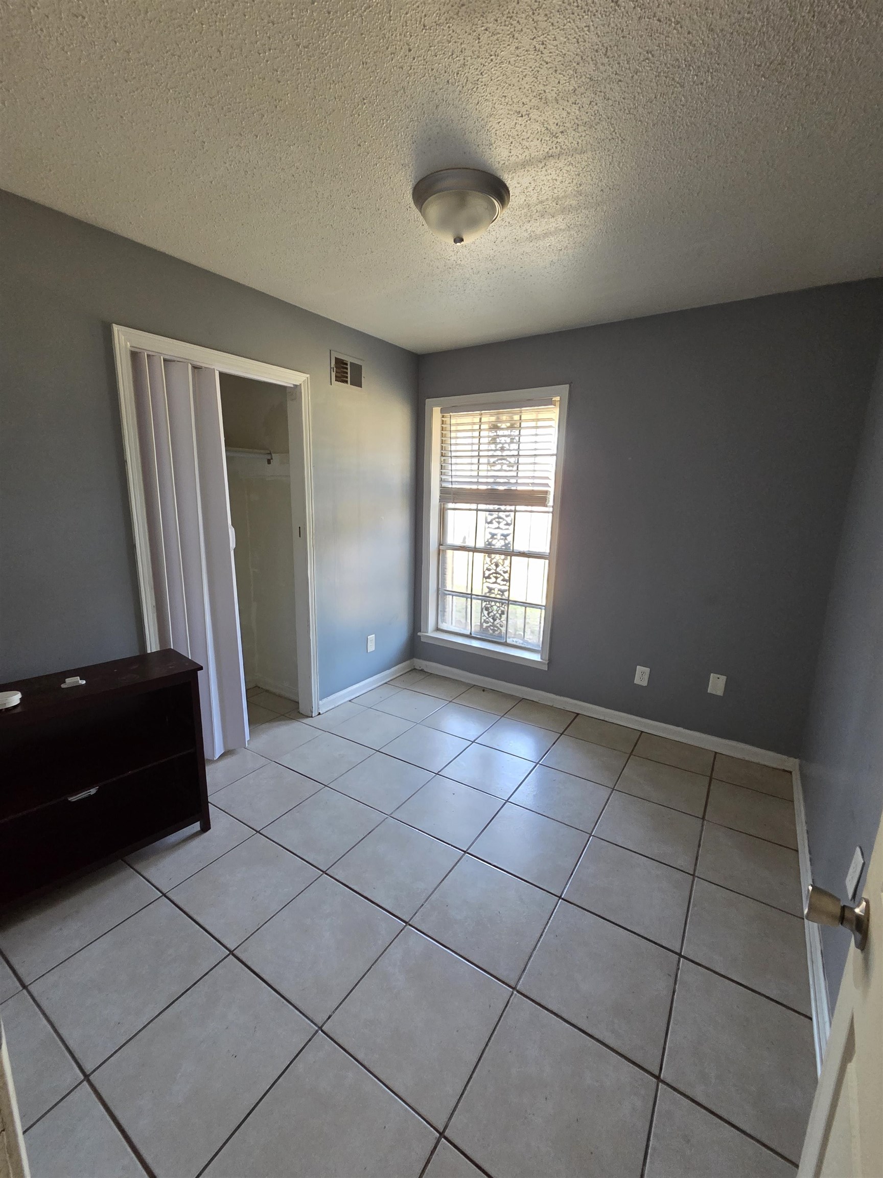 493 Tonawanda Cove Memphis, TN 38109 - Photo 12 of 15 a view of an empty room with a window