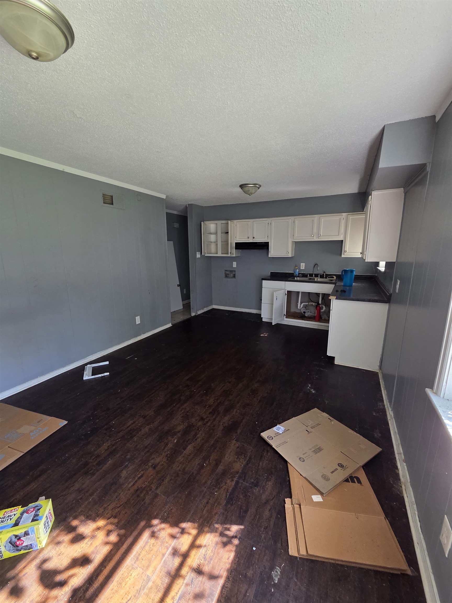 493 Tonawanda Cove Memphis, TN 38109 - Photo 5 of 15 a open kitchen with a sink dishwasher stove and cabinets