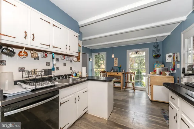 a kitchen with lots of counter top space and dining table