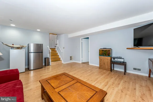 a bed room with a bed and a television