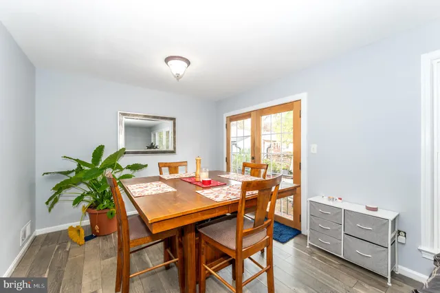 a view of a workspace with furniture and a potted plant