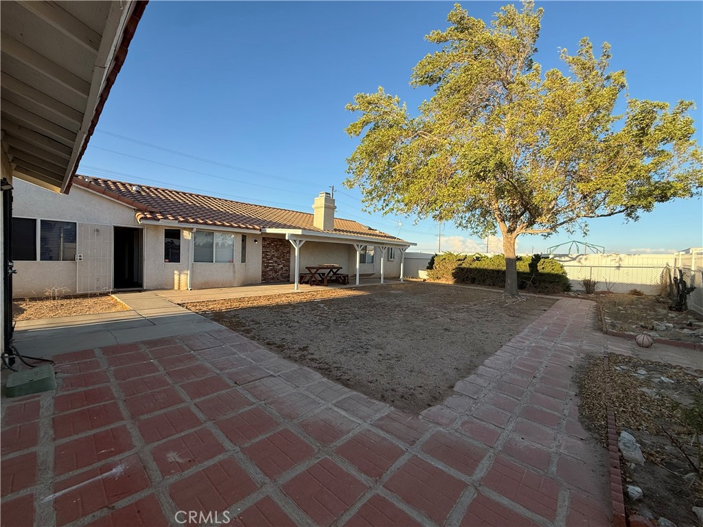 7653 Phelan Road Phelan, CA 92371 - Photo 5 of 10 a front view of a house with a yard