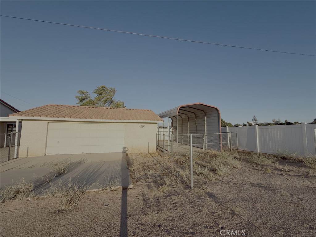 7653 Phelan Road Phelan, CA 92371 - Photo 6 of 10 a view of a house with a snow in the yard