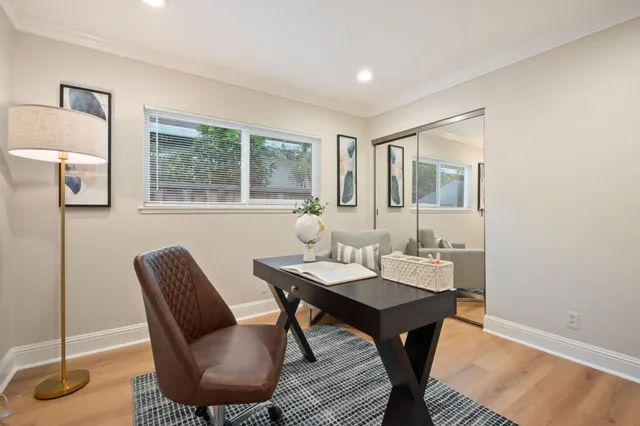 a view of a dining room with furniture and window