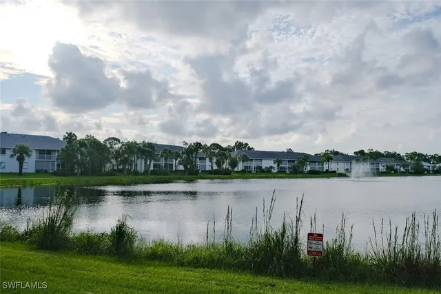 a view of a lake with houses in background
