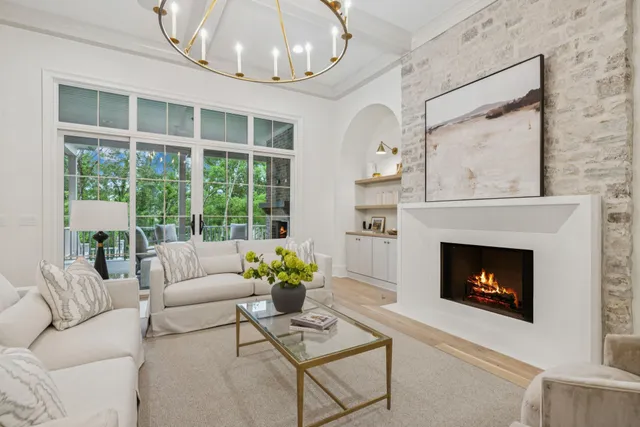 a kitchen with kitchen island granite countertop a sink cabinets and refrigerator
