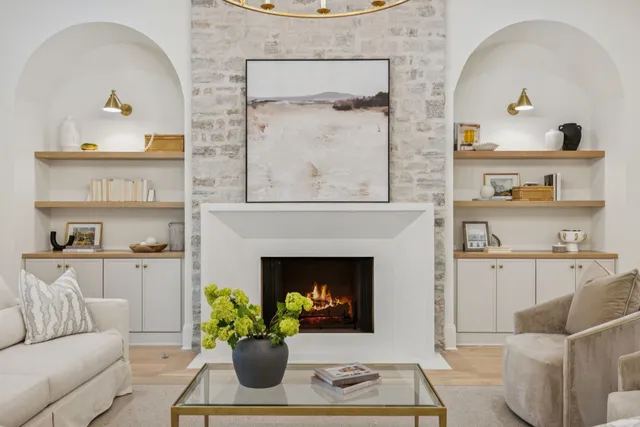 a kitchen with cabinets appliances and wooden floor