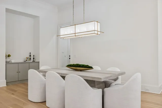 a spacious bathroom with a double vanity sink a mirror and a bathtub
