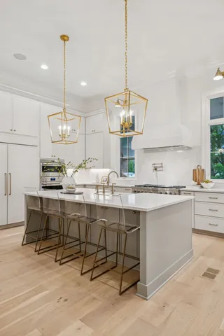 a bathroom with a double vanity sink mirror and shower
