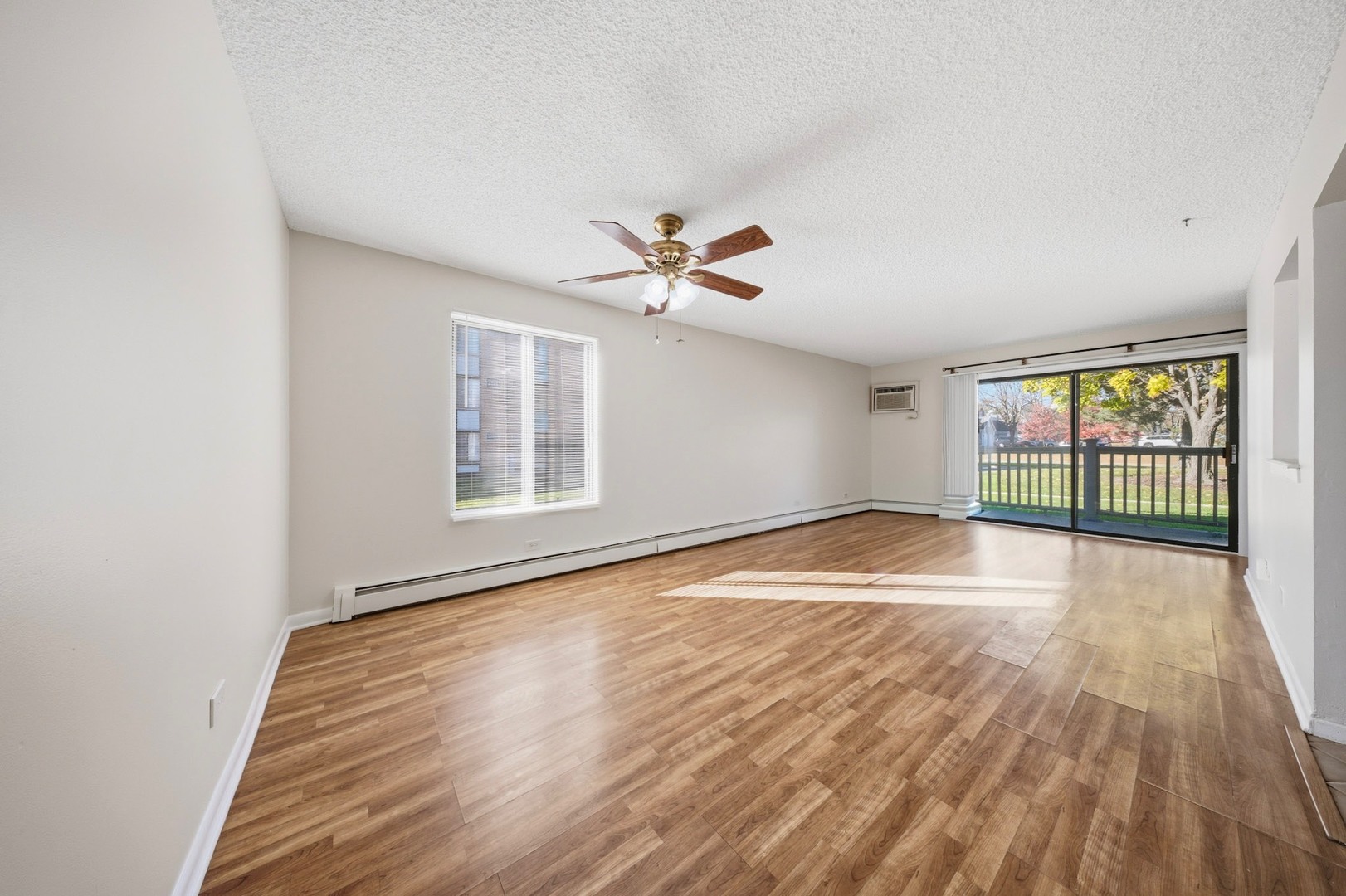 291 North Gregory Street, Unit 6 Aurora, IL 60504 - Photo 12 of 27 wooden floor in an empty room with a window
