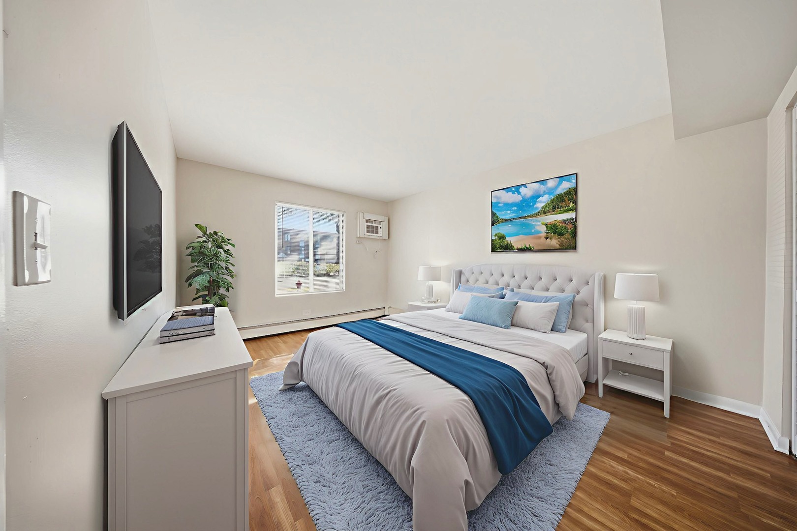 291 North Gregory Street, Unit 6 Aurora, IL 60504 - Photo 14 of 27 a bedroom with bed and a couch