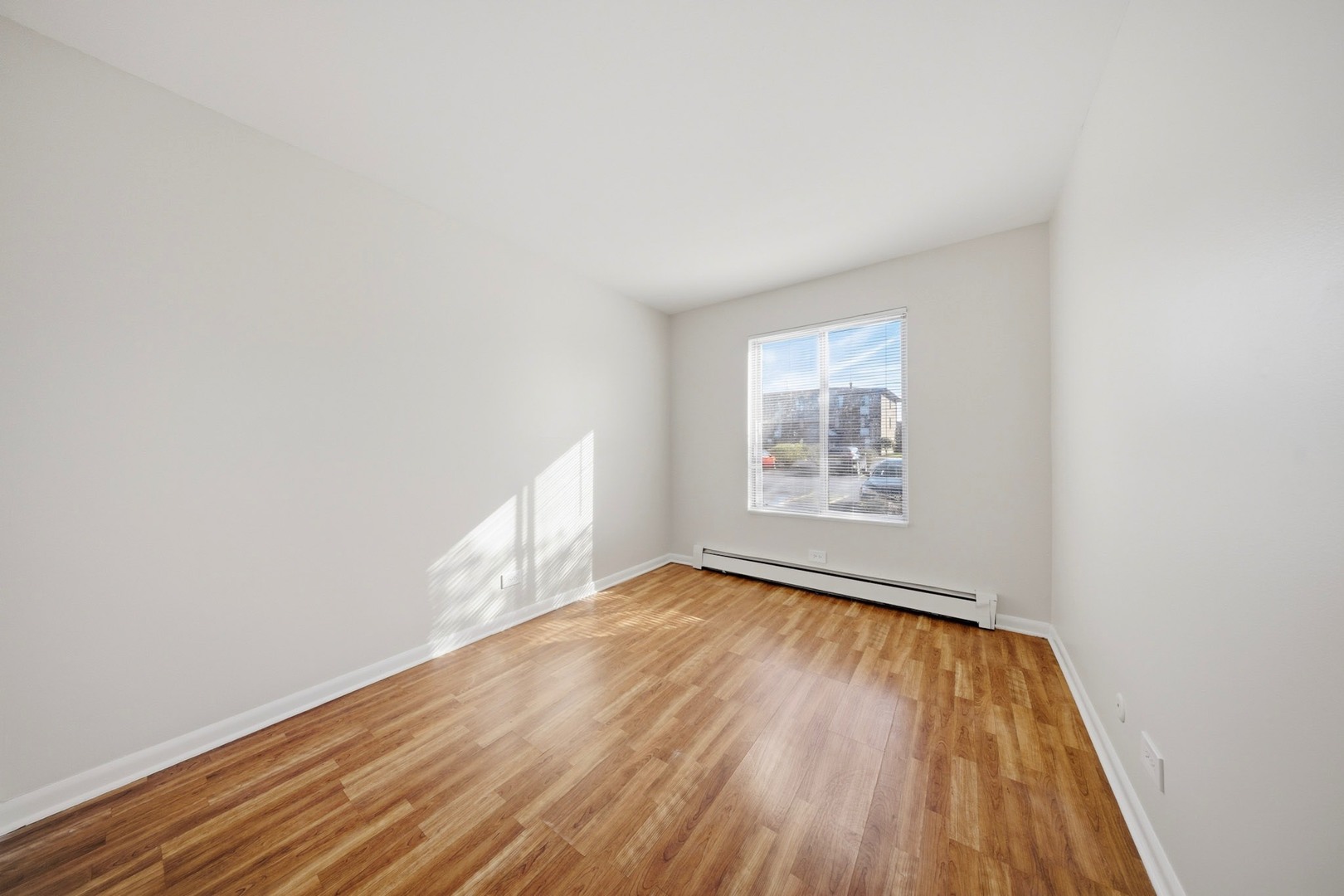 291 North Gregory Street, Unit 6 Aurora, IL 60504 - Photo 17 of 27 a view of an empty room and wooden floor