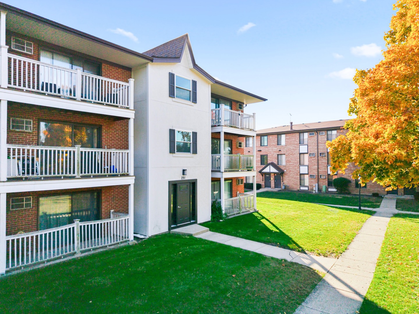 291 North Gregory Street, Unit 6 Aurora, IL 60504 - Photo 2 of 27 a view of an house with backyard and a swimming pool
