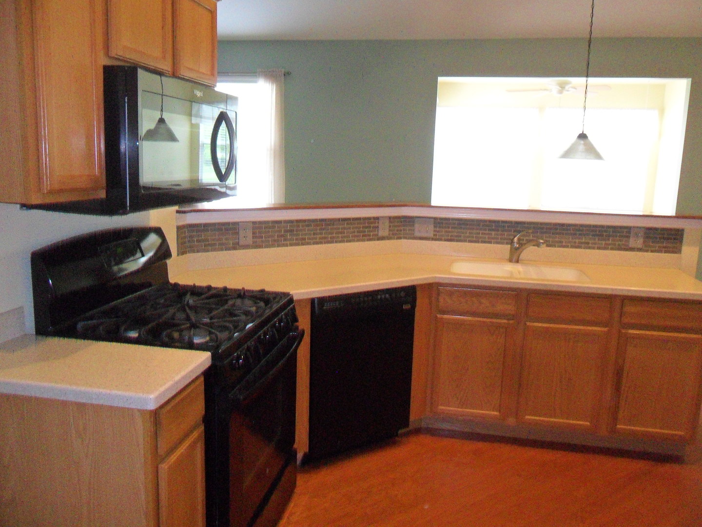678 Cadillac Circle Romeoville, IL 60446 - Photo 7 of 19 a kitchen with a sink stove and cabinets