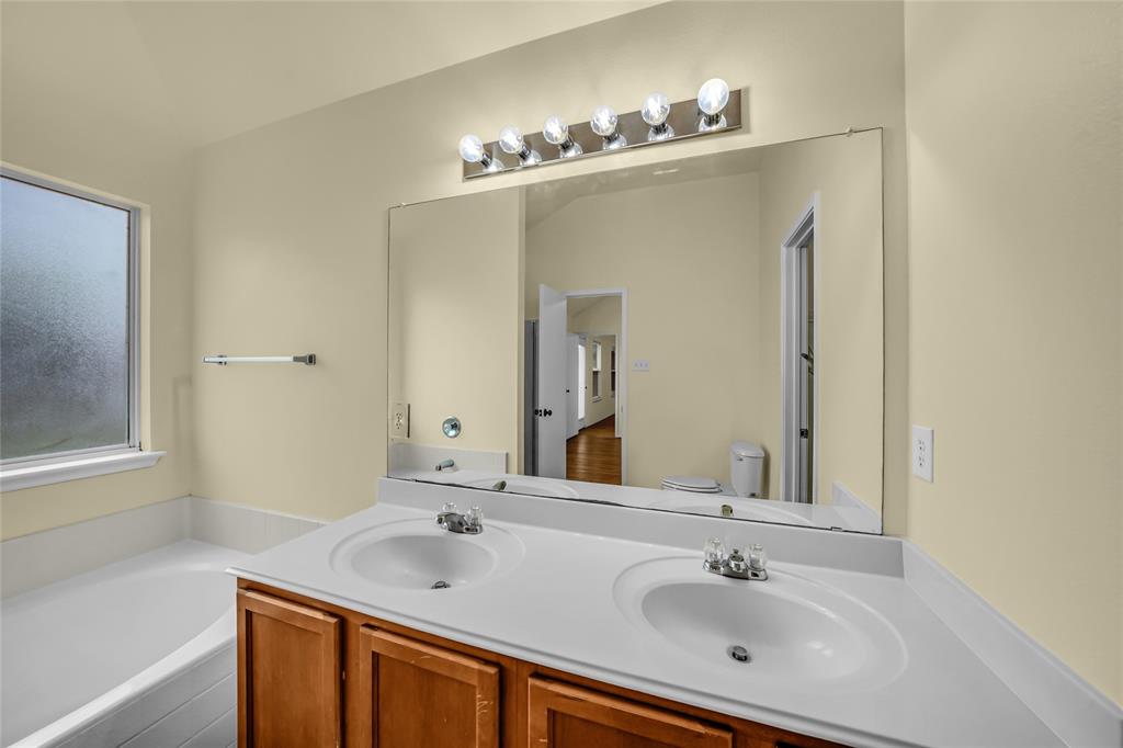 705 Loftin Street Crowley, TX 76036 - Photo 19 of 31 Full bath with double vanity and a garden tub