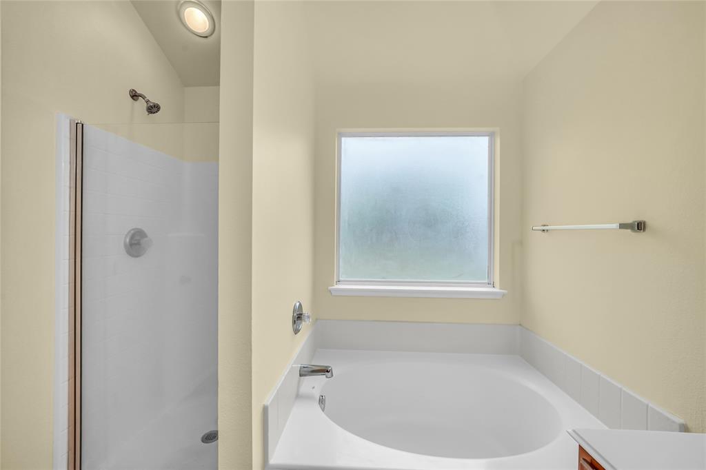 705 Loftin Street Crowley, TX 76036 - Photo 20 of 31 Full bath with a shower stall, a bath, and vanity