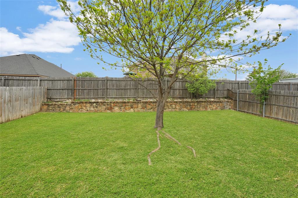 705 Loftin Street Crowley, TX 76036 - Photo 28 of 31 View of fenced backyard