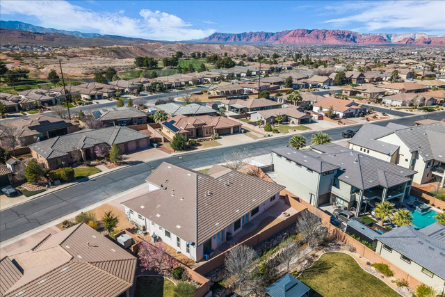 691 Rainier Drive St. George, UT 84770 - Photo 22 of 24 Aerial view of residential area featuring a mountain backdrop