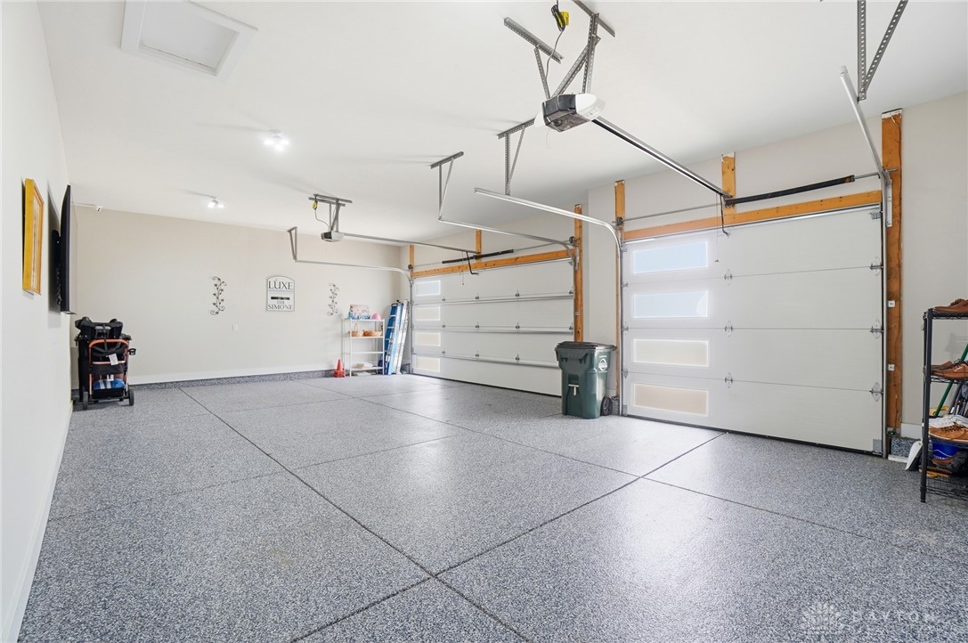 1247 Normandy Rue Dayton, OH 45458 - Photo 56 of 76 This spacious garage offers ample room with poxy floor.
