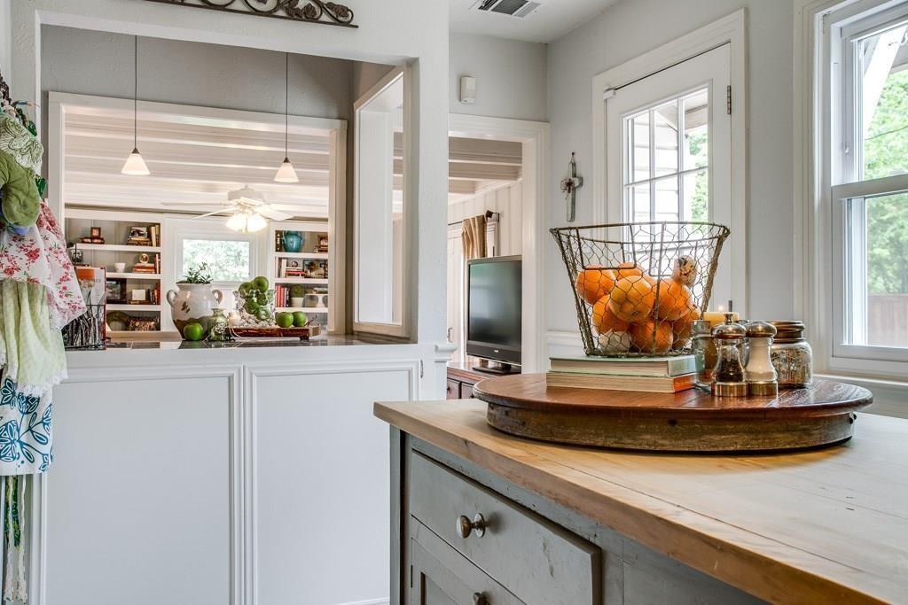6043 Llano Avenue Dallas, TX 75206 - Photo 14 of 40 a view of a kitchen with stainless steel appliances granite countertop a sink and a large window