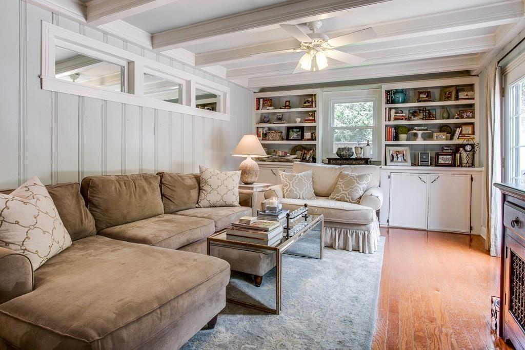 6043 Llano Avenue Dallas, TX 75206 - Photo 15 of 40 a living room with furniture and a book shelf