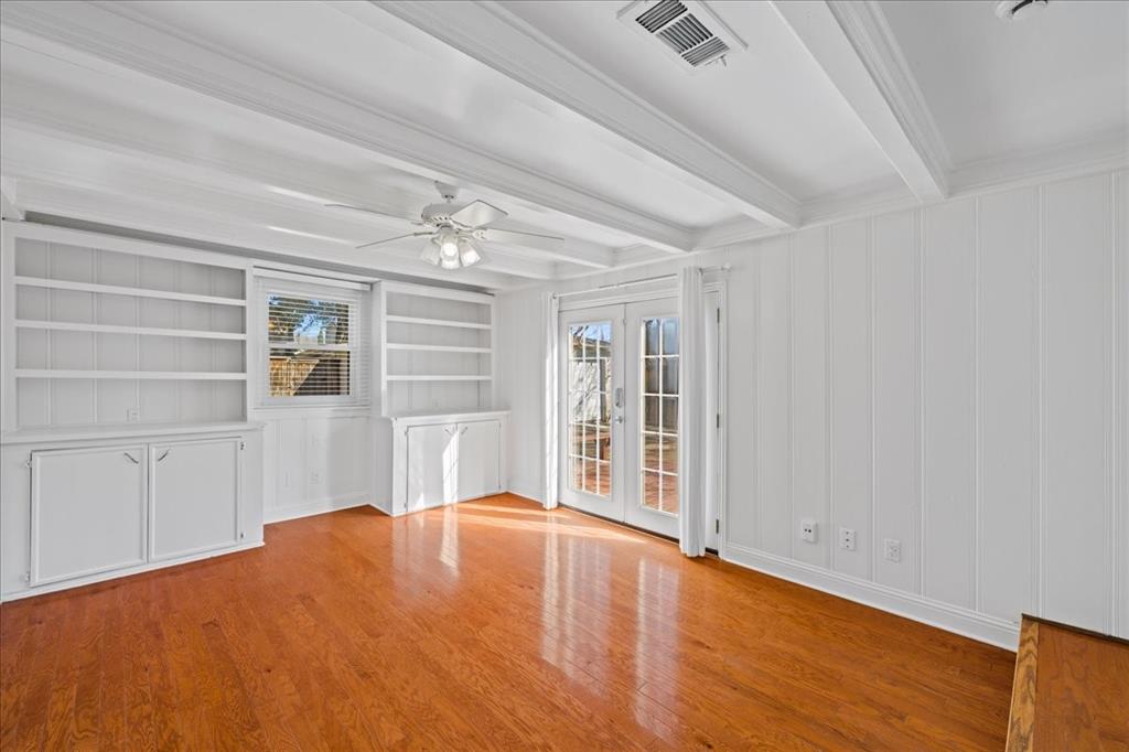 6043 Llano Avenue Dallas, TX 75206 - Photo 18 of 40 a view of empty room with wooden floor and fan