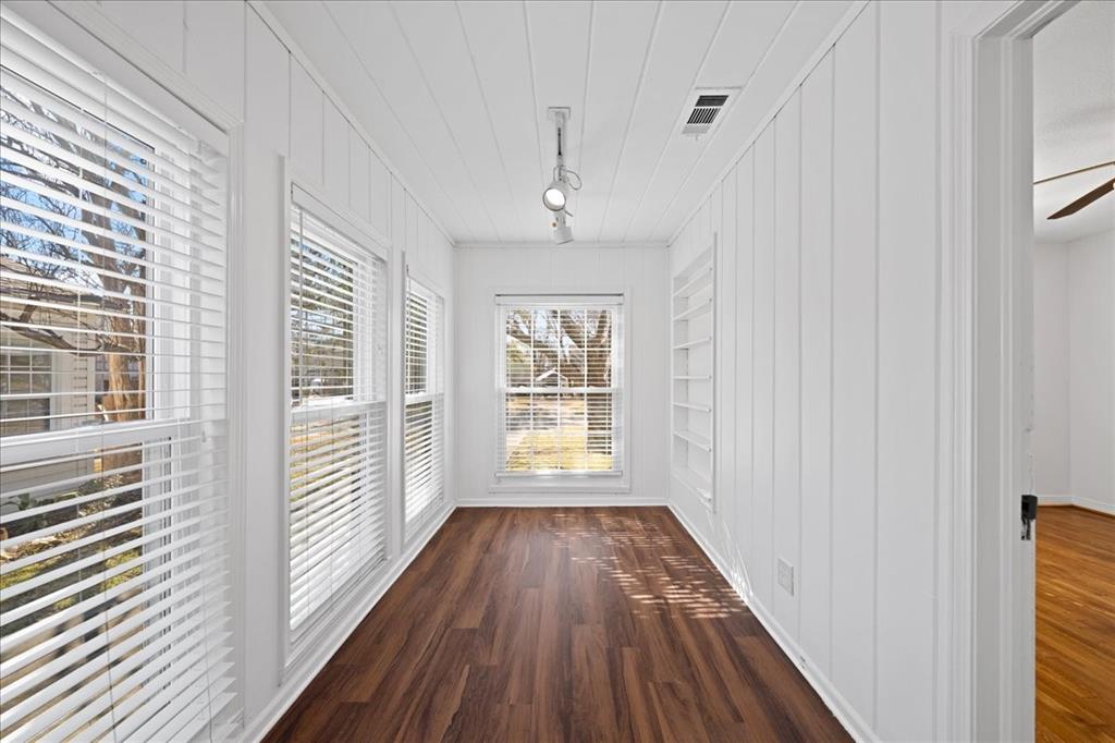 6043 Llano Avenue Dallas, TX 75206 - Photo 24 of 40 a view of a hallway with wooden floor and a window