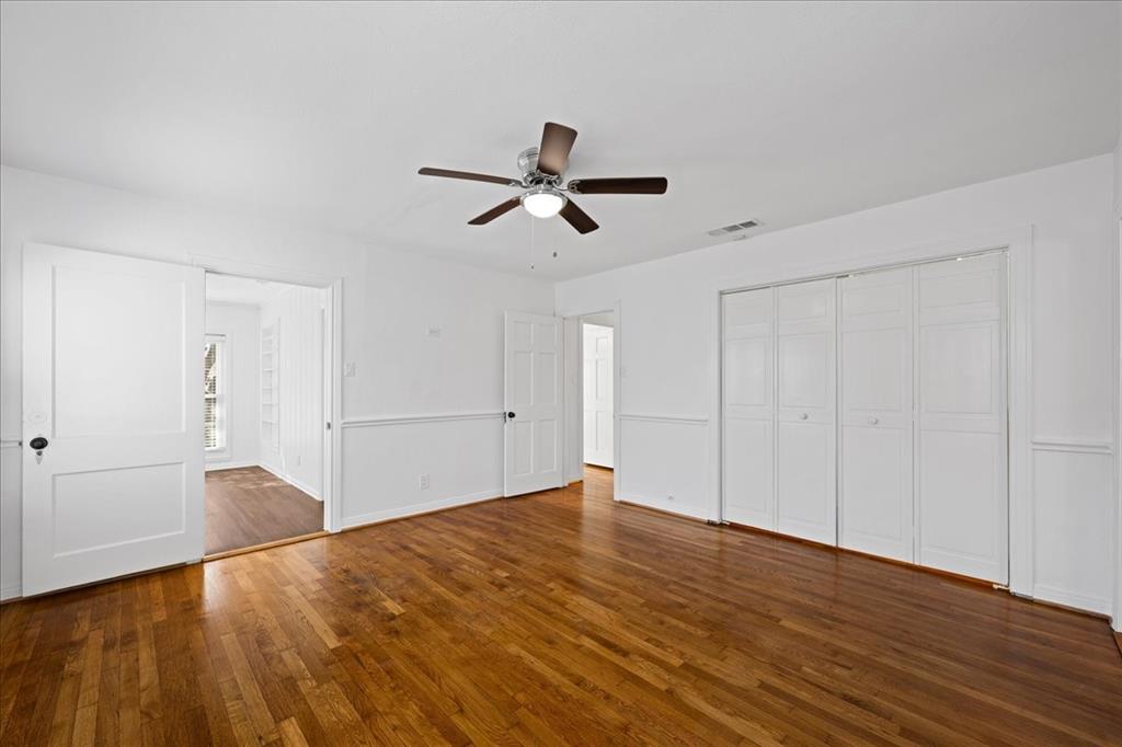 6043 Llano Avenue Dallas, TX 75206 - Photo 28 of 40 a view of empty room with wooden floor and ceiling fan
