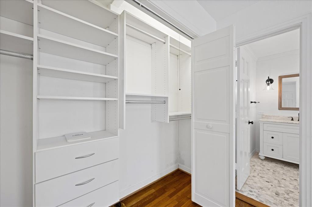 6043 Llano Avenue Dallas, TX 75206 - Photo 29 of 40 a view of walk in closet with empty racks