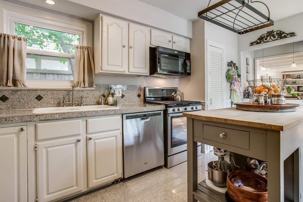 6043 Llano Avenue Dallas, TX 75206 - Photo 9 of 40 a kitchen with stainless steel appliances white cabinets and a sink
