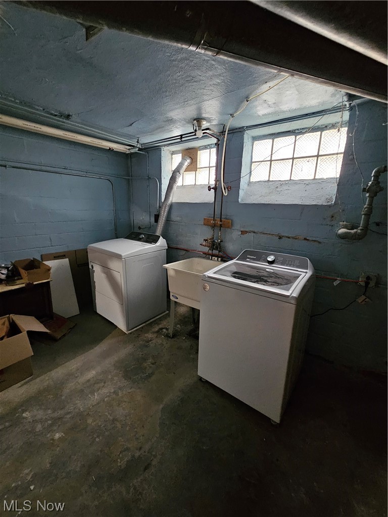 3688 Rolliston Road Cleveland, OH 44120 - Photo 38 of 44 Clothes washing area featuring washing machine and clothes dryer and sink