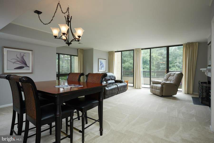 11602 Windbluff Court, Unit 8A1 Reston, VA 20191 - Photo 2 of 27 a view of a livingroom with furniture window and outside view