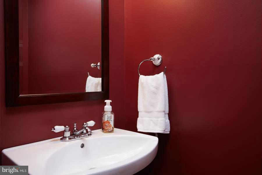 11602 Windbluff Court, Unit 8A1 Reston, VA 20191 - Photo 14 of 27 a bathroom with a sink and a mirror