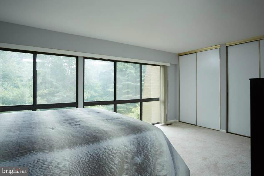 11602 Windbluff Court, Unit 8A1 Reston, VA 20191 - Photo 16 of 27 a view of an empty room with a window