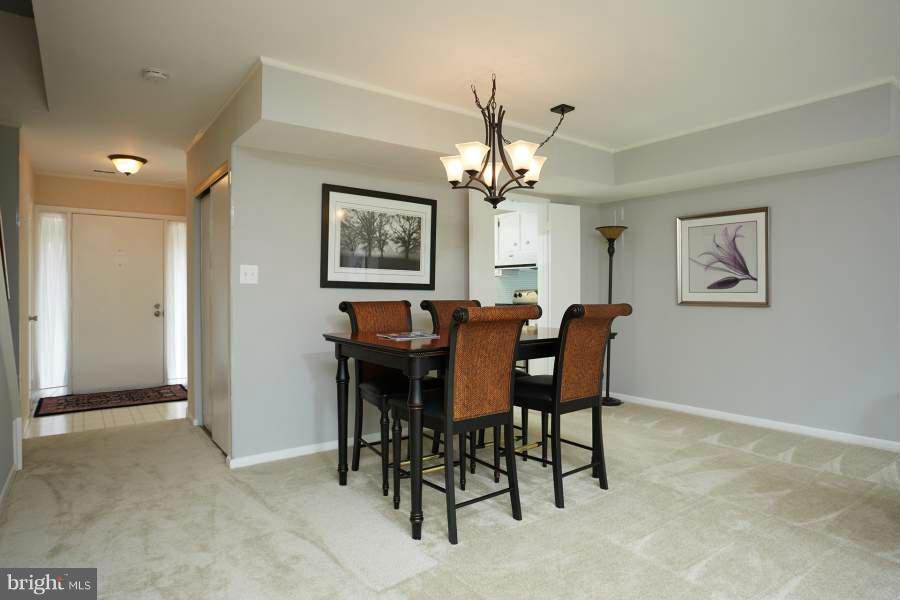 11602 Windbluff Court, Unit 8A1 Reston, VA 20191 - Photo 3 of 27 a view of a dining room with furniture