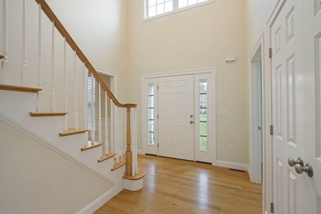 1 Applegate Road Medway, MA 02053 - Photo 3 of 41 a view of an entryway with wooden floor and staircase