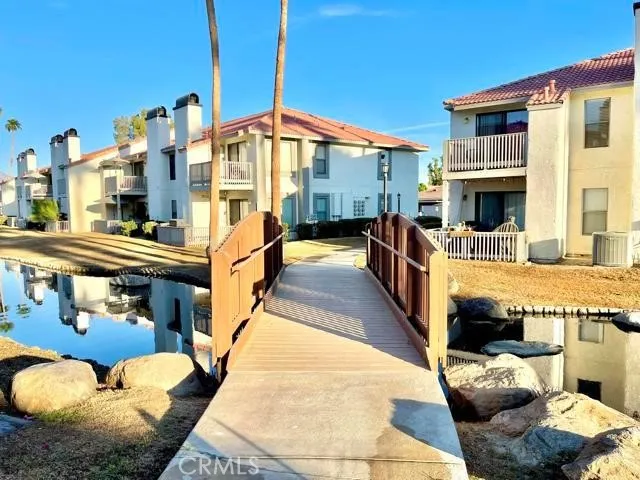a view of a swimming pool with sitting area