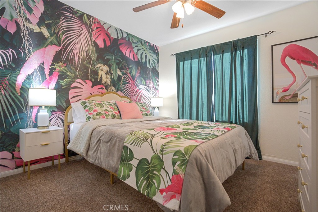 43376 Cook Street, Unit 125 Palm Desert, CA 92211 - Photo 23 of 45 a bedroom with a bed and a painting on the wall