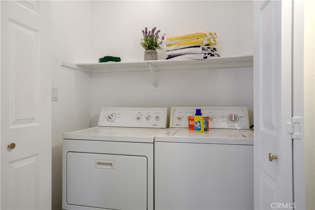 43376 Cook Street, Unit 125 Palm Desert, CA 92211 - Photo 26 of 45 a view of storage and utility room with washer and dryer