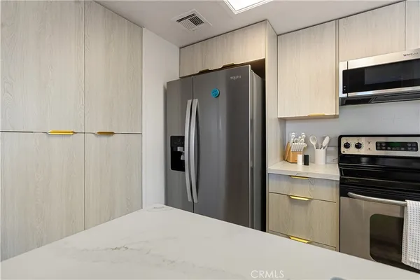 a kitchen with a stove and a microwave