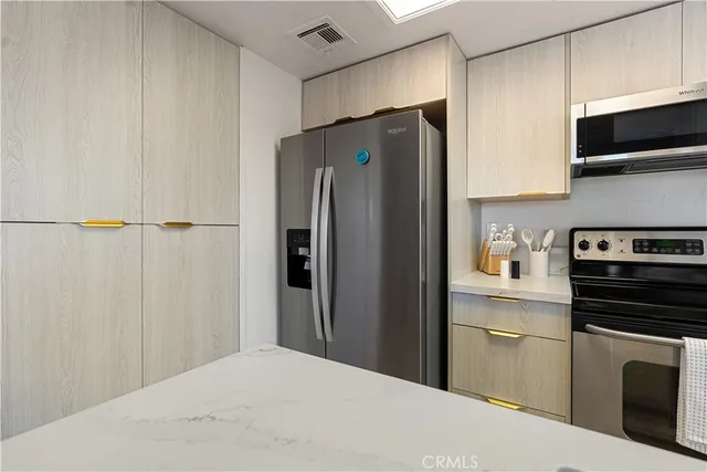 a kitchen with a stove and a microwave