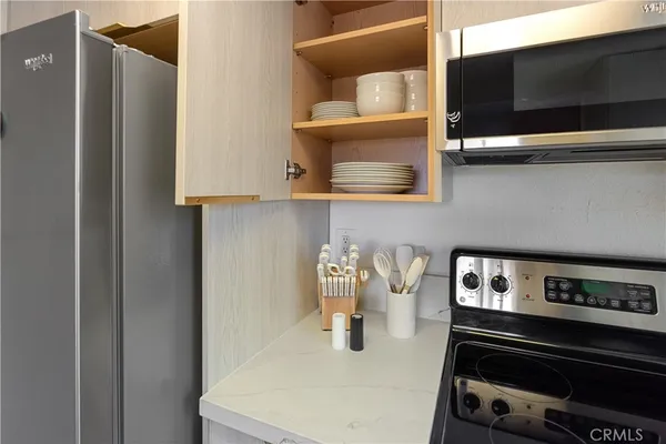a kitchen with a sink and a refrigerator
