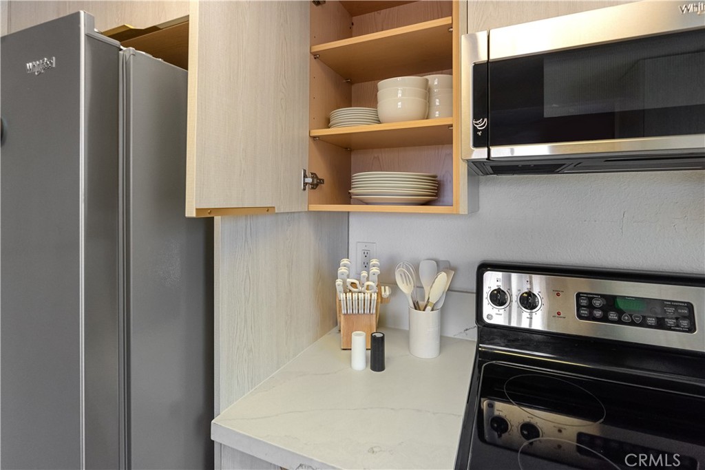 43376 Cook Street, Unit 125 Palm Desert, CA 92211 - Photo 28 of 45 a kitchen with a stove and a microwave