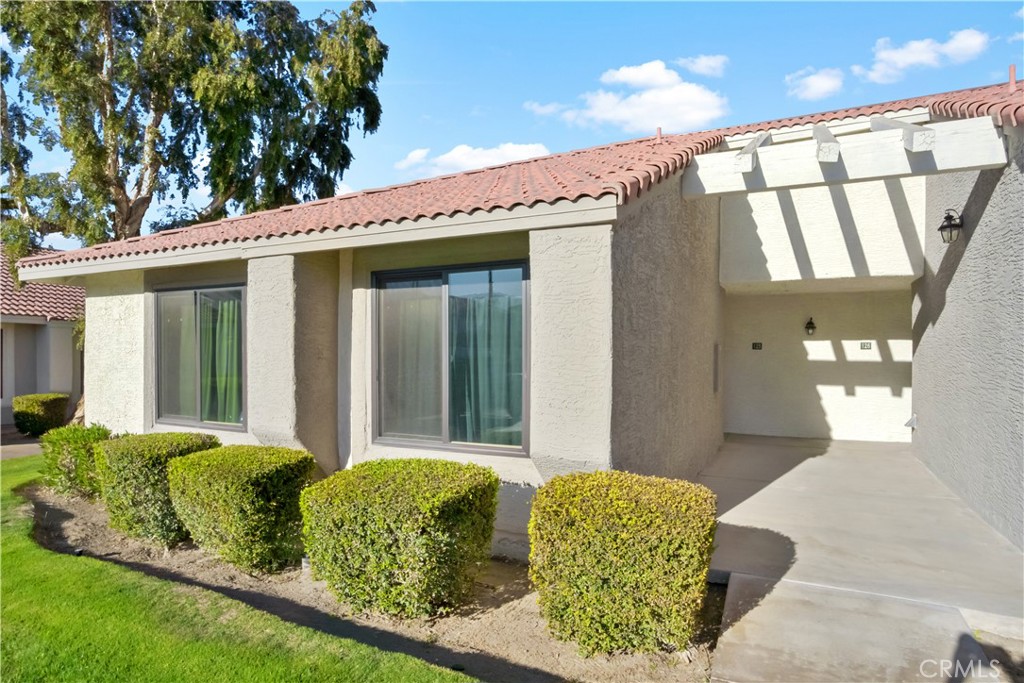 43376 Cook Street, Unit 125 Palm Desert, CA 92211 - Photo 4 of 45 a front view of a house with garden