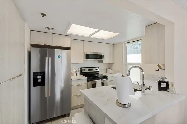 a kitchen with a stove and a microwave