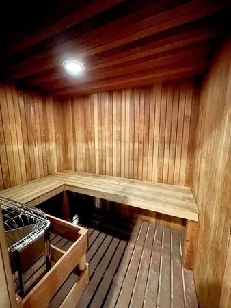 a kitchen with wooden cabinets and outdoor space