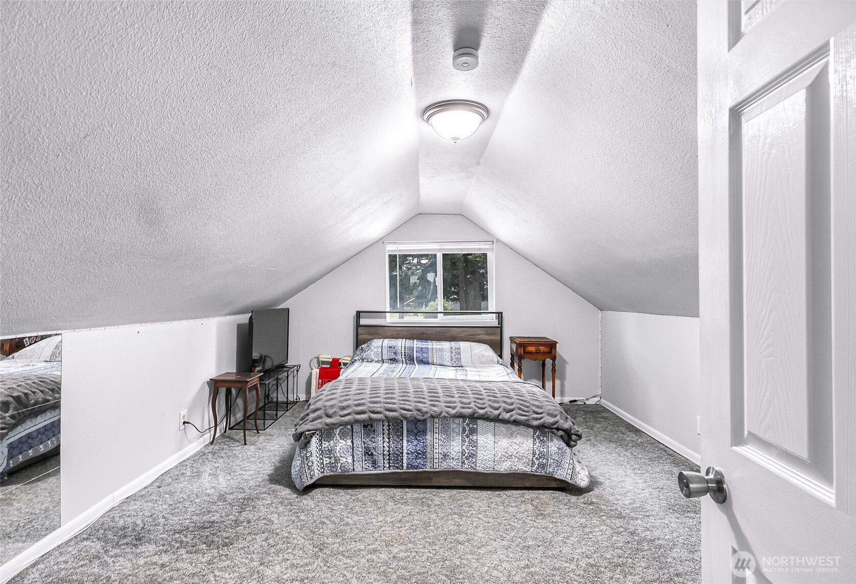 6981 Hannegan Road Lynden, WA 98264 - Photo 19 of 25 a bedroom with bed and a window