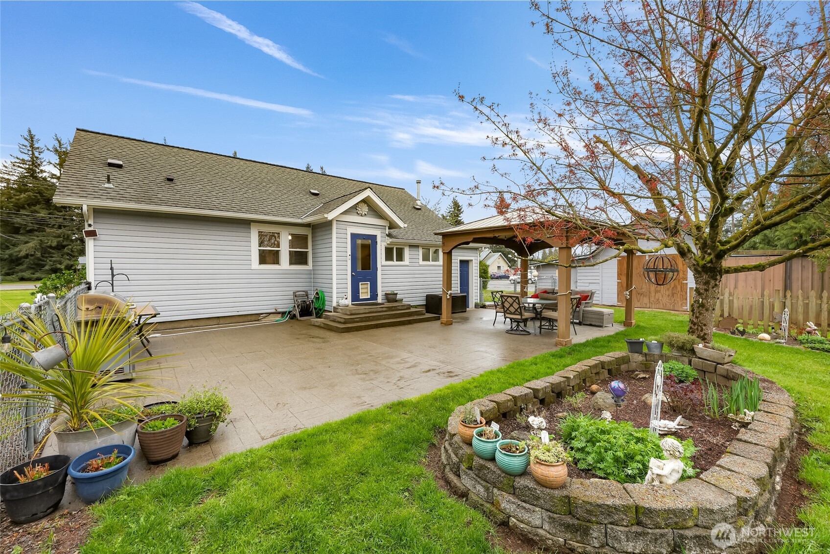 6981 Hannegan Road Lynden, WA 98264 - Photo 21 of 25 a front view of a house with swimming pool yard and patio