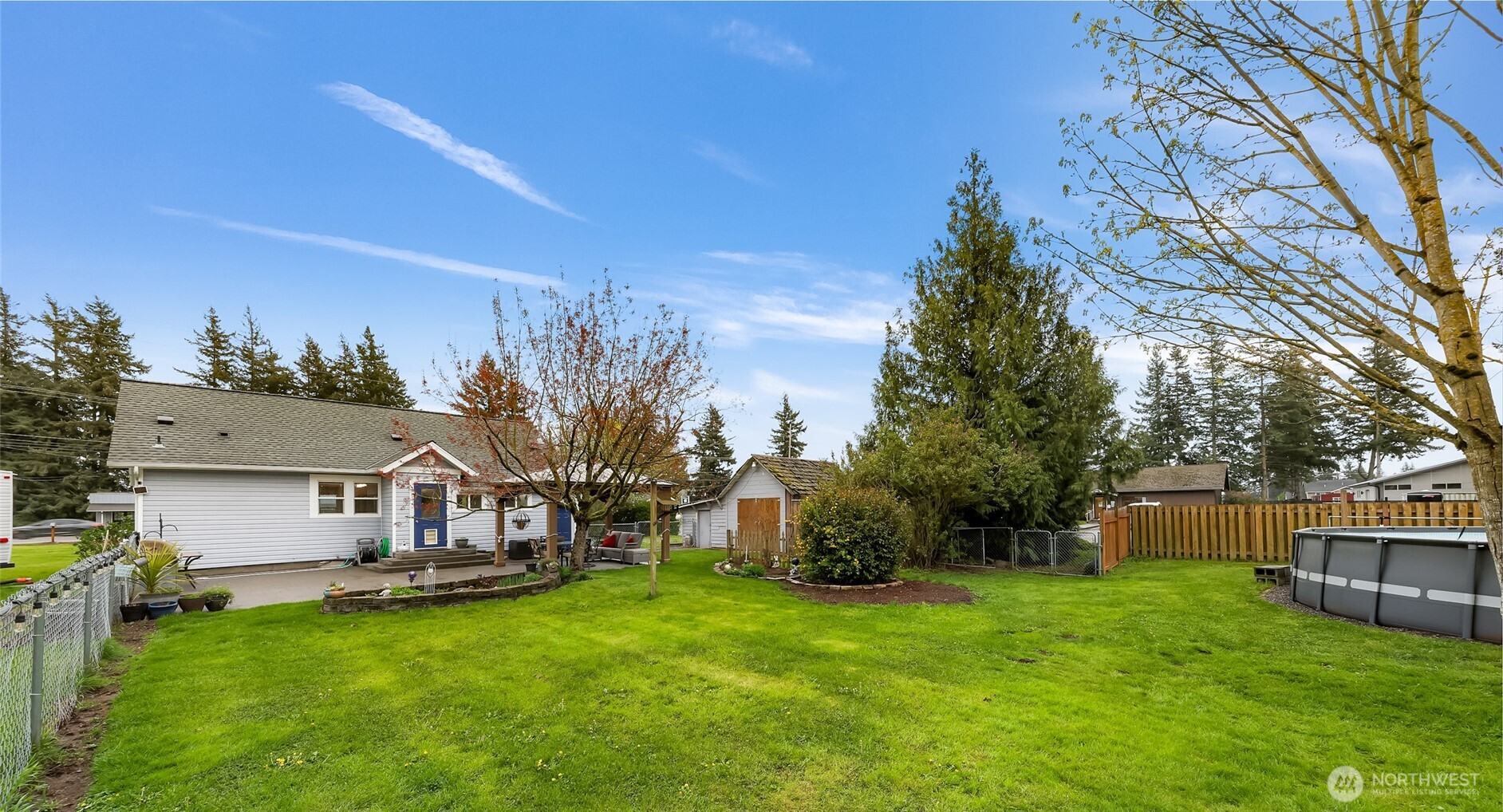 6981 Hannegan Road Lynden, WA 98264 - Photo 22 of 25 a view of a house with backyard and sitting area