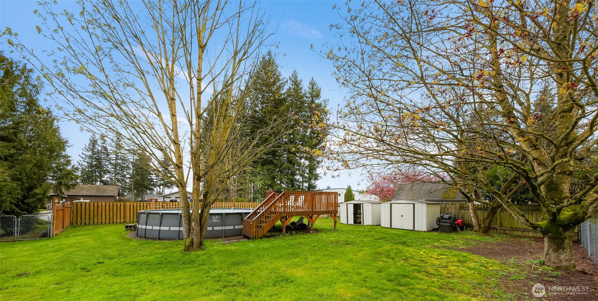 6981 Hannegan Road Lynden, WA 98264 - Photo 23 of 25 a view of a house with a big yard and large trees